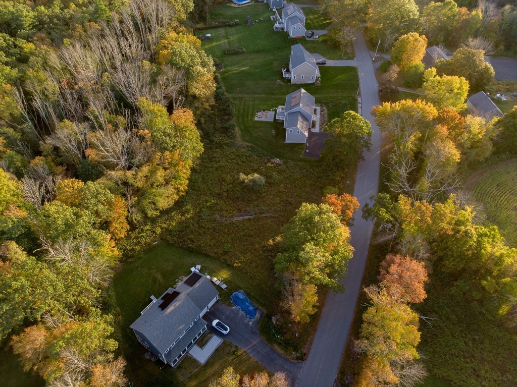 235 Podunk Road Sturbridge, MA 01566 - Photo 4 of 11 an aerial view of a house with a yard