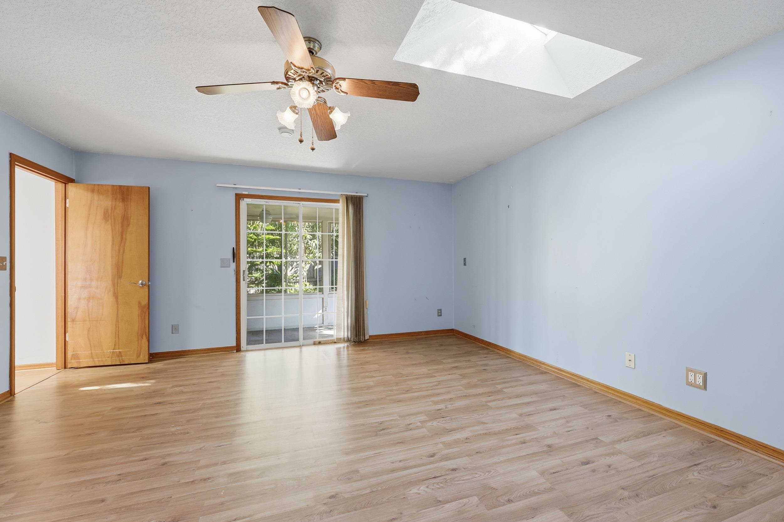 115 Segovia Road St. Augustine, FL 32086 - Photo 17 of 48 an empty room with wooden floor fan and windows