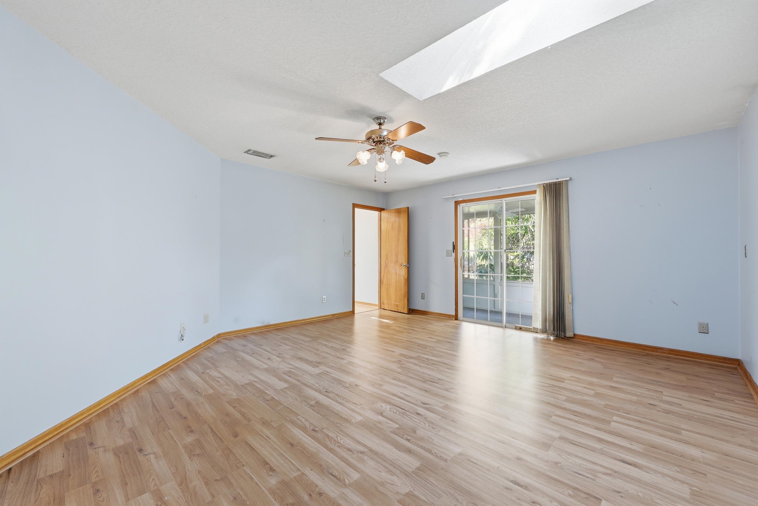 115 Segovia Road St. Augustine, FL 32086 - Photo 18 of 48 wooden floor in an empty room with a window