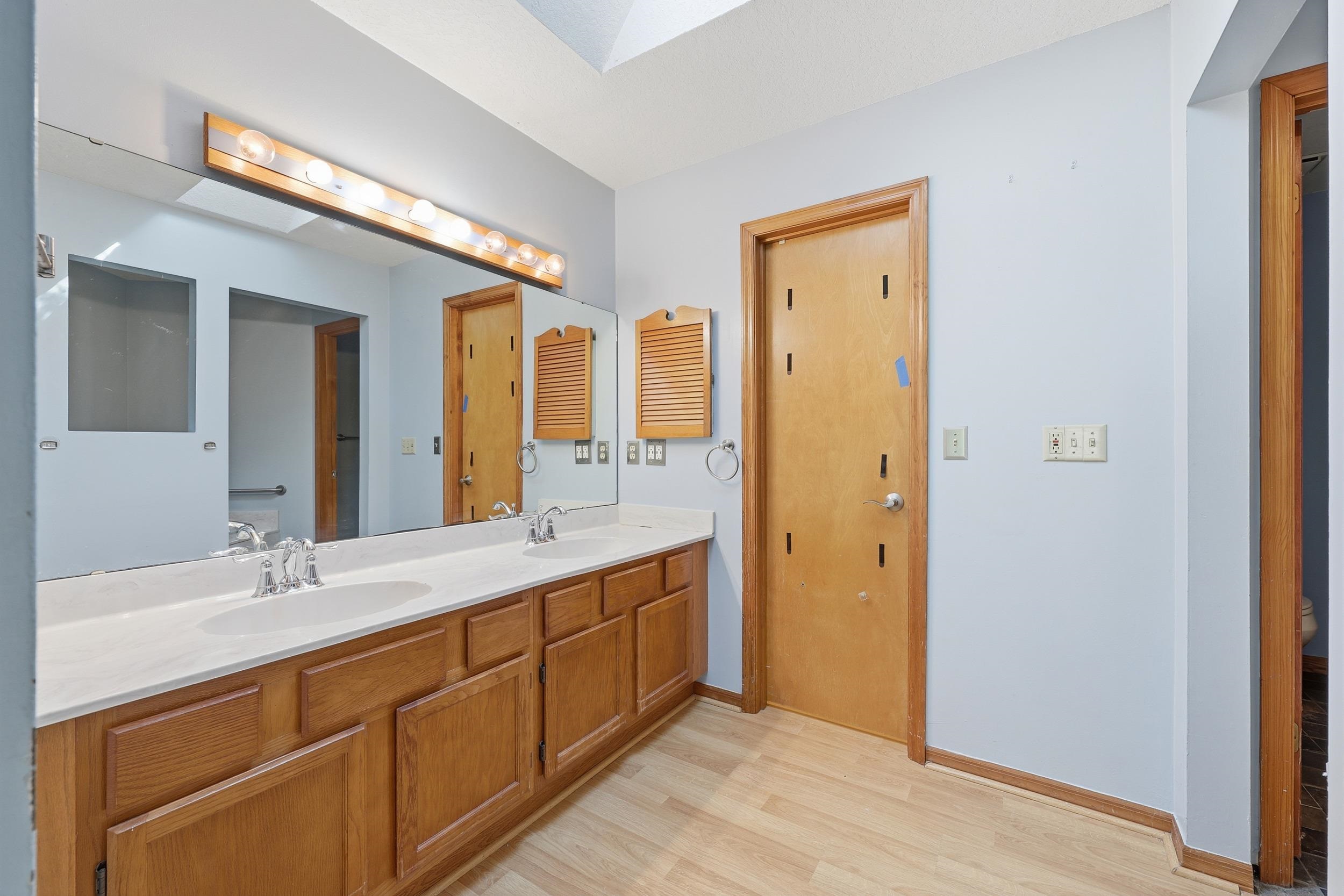 115 Segovia Road St. Augustine, FL 32086 - Photo 20 of 48 a spacious bathroom with a double vanity sink and a mirror