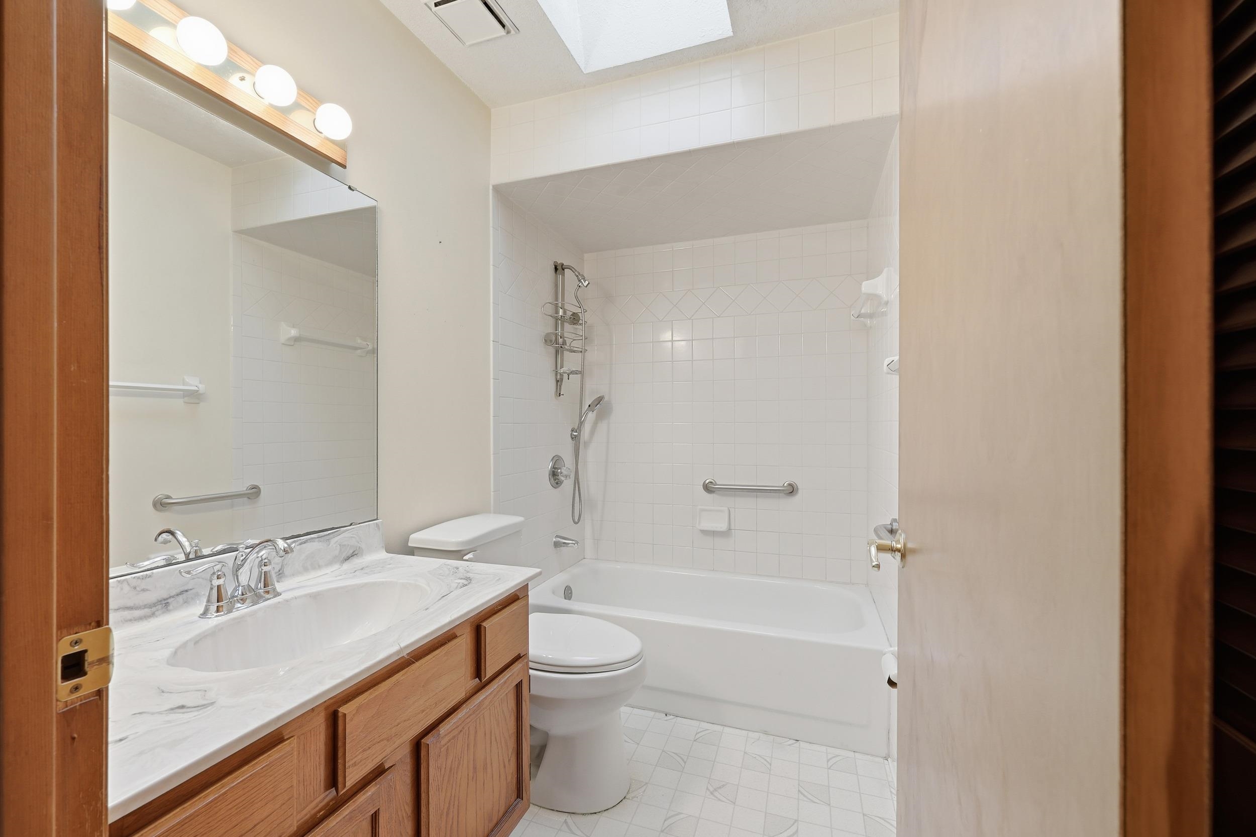 115 Segovia Road St. Augustine, FL 32086 - Photo 25 of 48 a bathroom with a granite countertop sink a toilet and shower