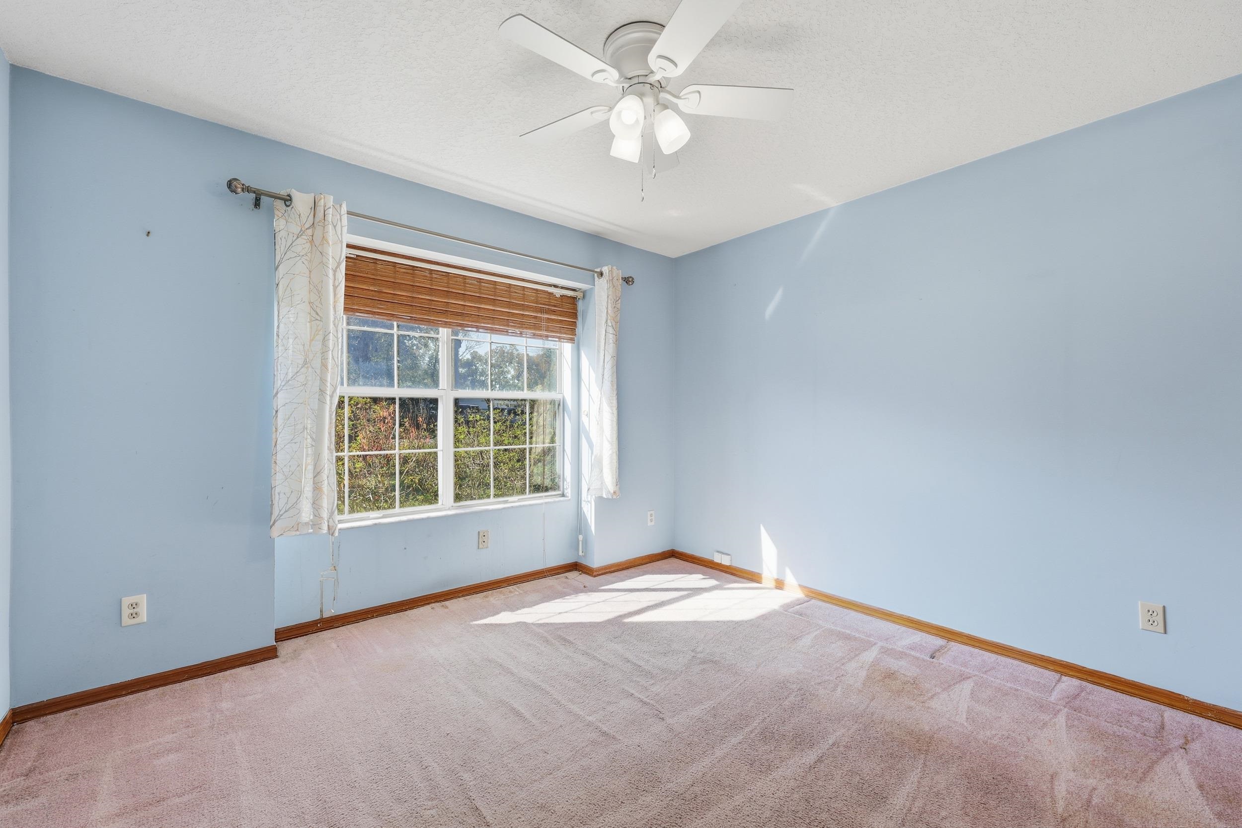 115 Segovia Road St. Augustine, FL 32086 - Photo 27 of 48 Unfurnished room featuring light carpet, a textured ceiling, and a ceiling fan