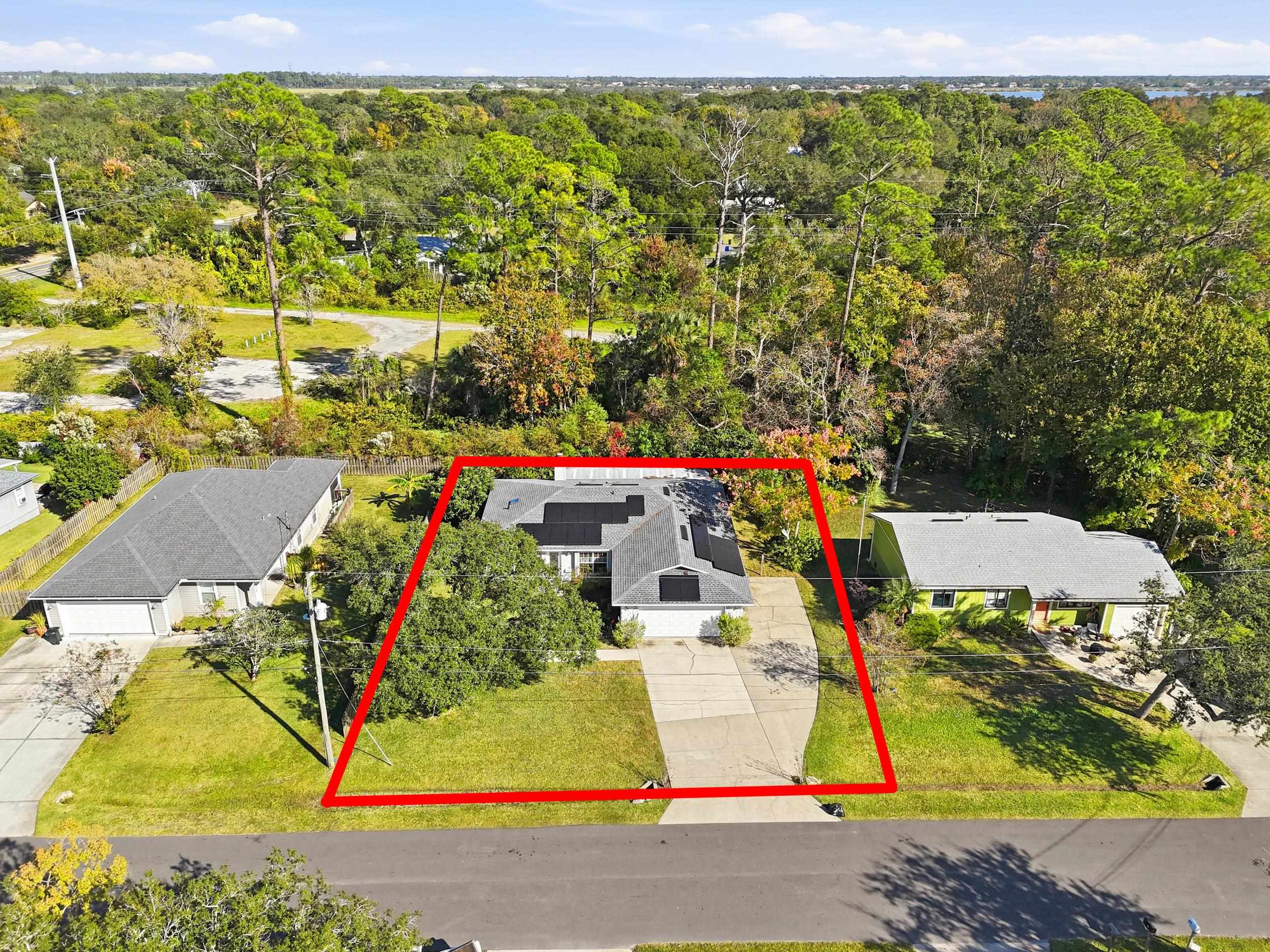 115 Segovia Road St. Augustine, FL 32086 - Photo 39 of 48 a view of outdoor space with seating area and trees in the background