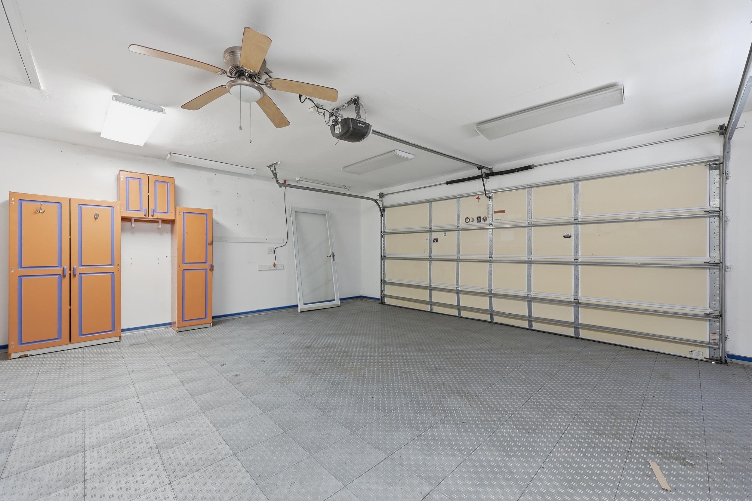 115 Segovia Road St. Augustine, FL 32086 - Photo 40 of 48 Garage with a garage door opener and ceiling fan