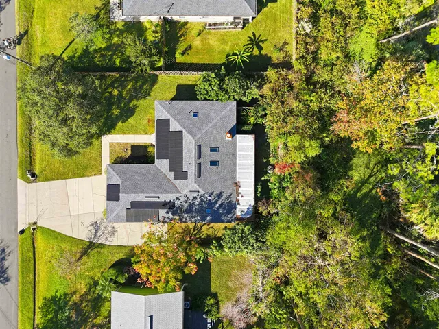 an aerial view of a house with a garden