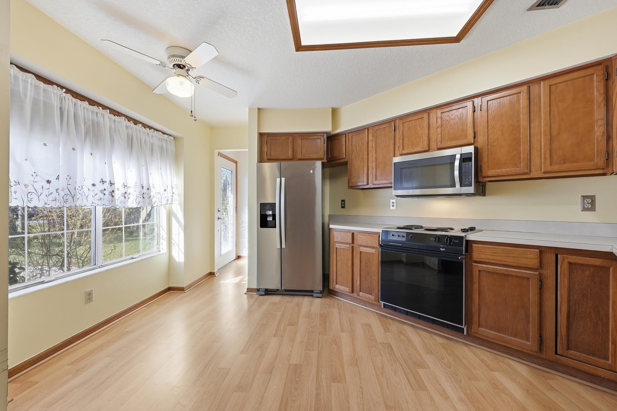 115 Segovia Road St. Augustine, FL 32086 - Photo 7 of 48 a kitchen with stainless steel appliances granite countertop a refrigerator a stove top oven a sink and dishwasher