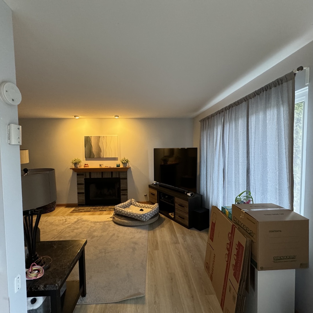 2614 Discovery Drive Plainfield, IL 60586 - Photo 11 of 28 a living room with furniture and a flat screen tv