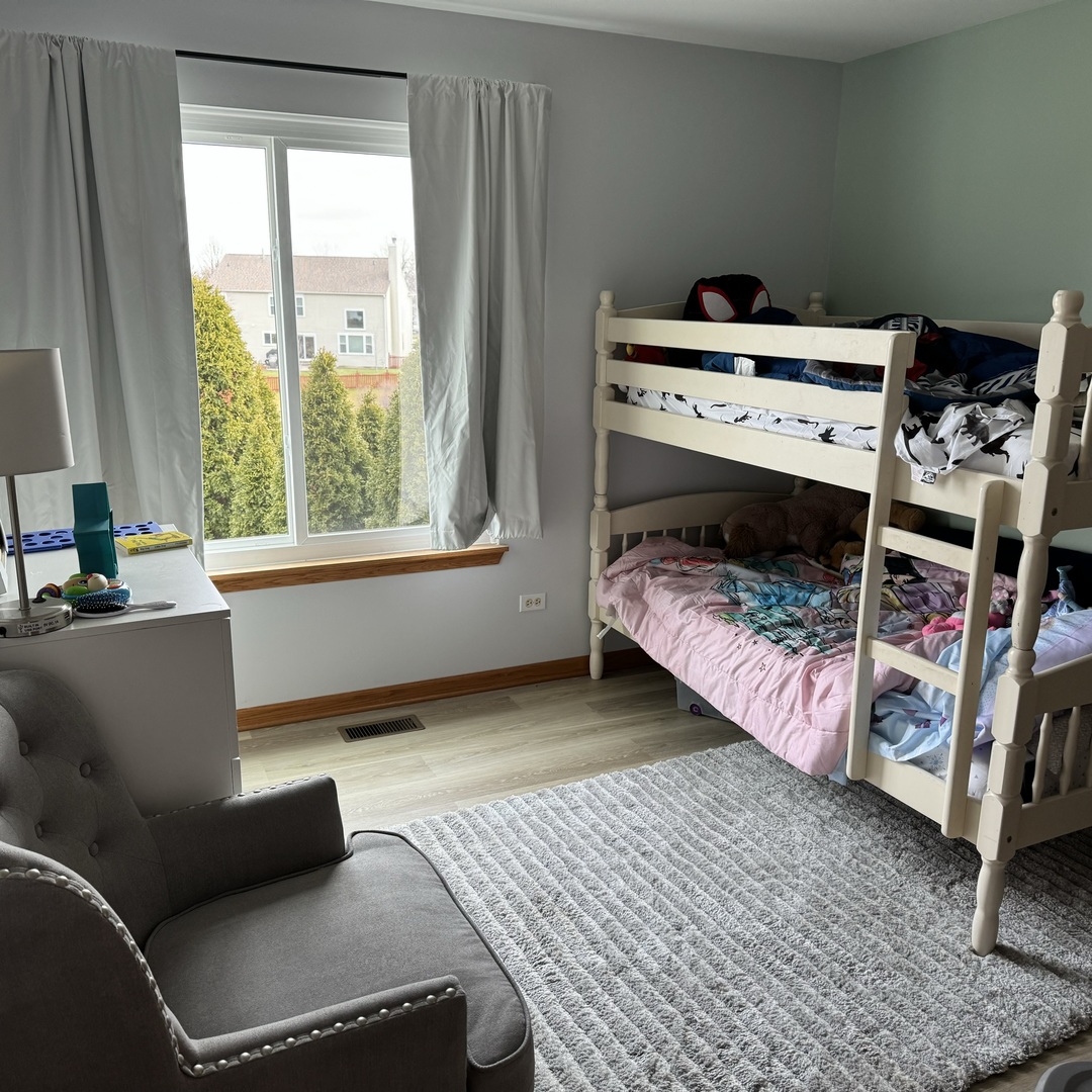 2614 Discovery Drive Plainfield, IL 60586 - Photo 18 of 28 a bedroom with a bed and a window