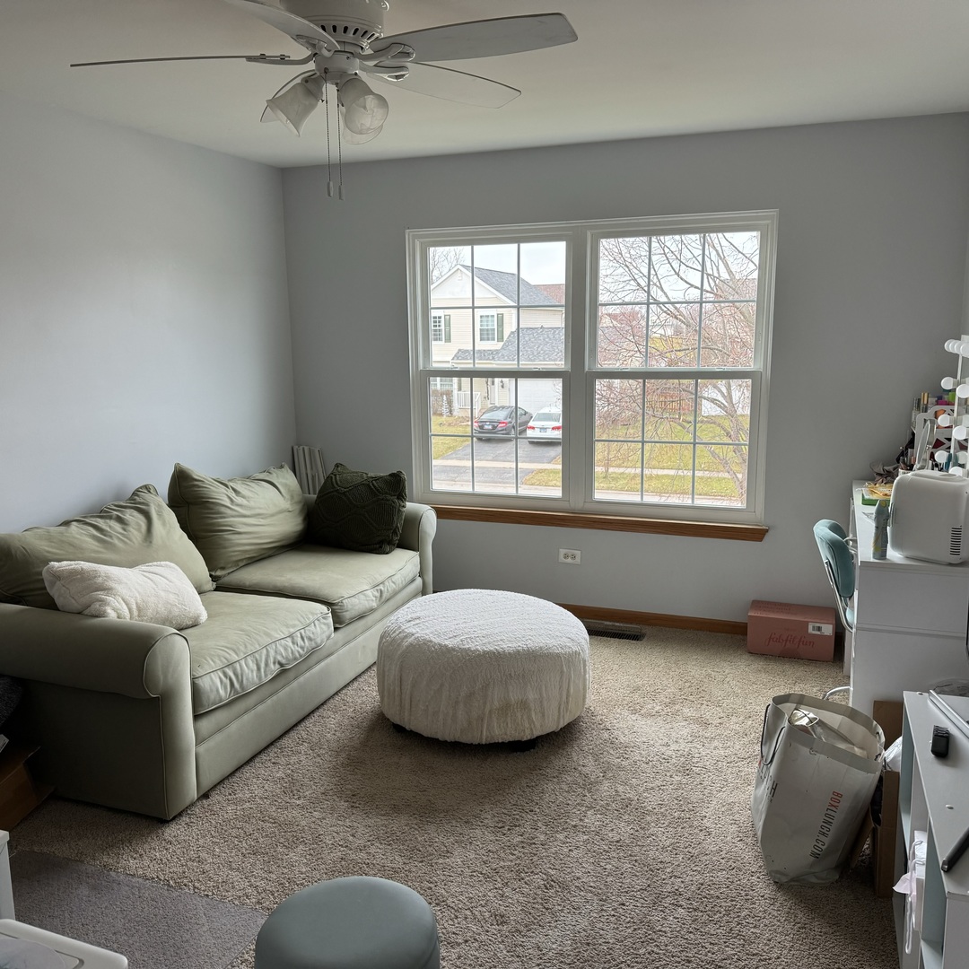 2614 Discovery Drive Plainfield, IL 60586 - Photo 21 of 28 a living room with furniture and a window
