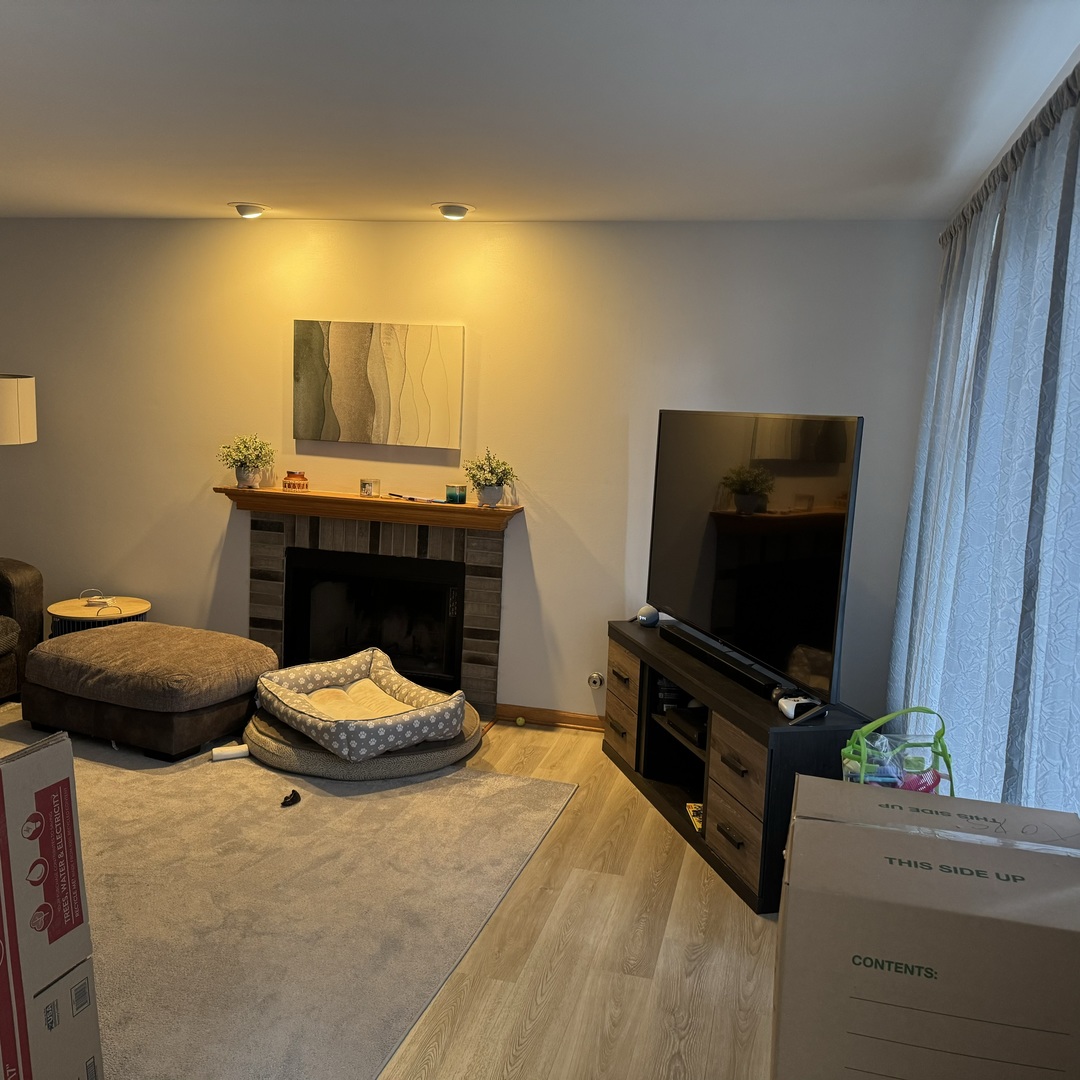 2614 Discovery Drive Plainfield, IL 60586 - Photo 10 of 28 a bedroom with a bed and flat screen tv