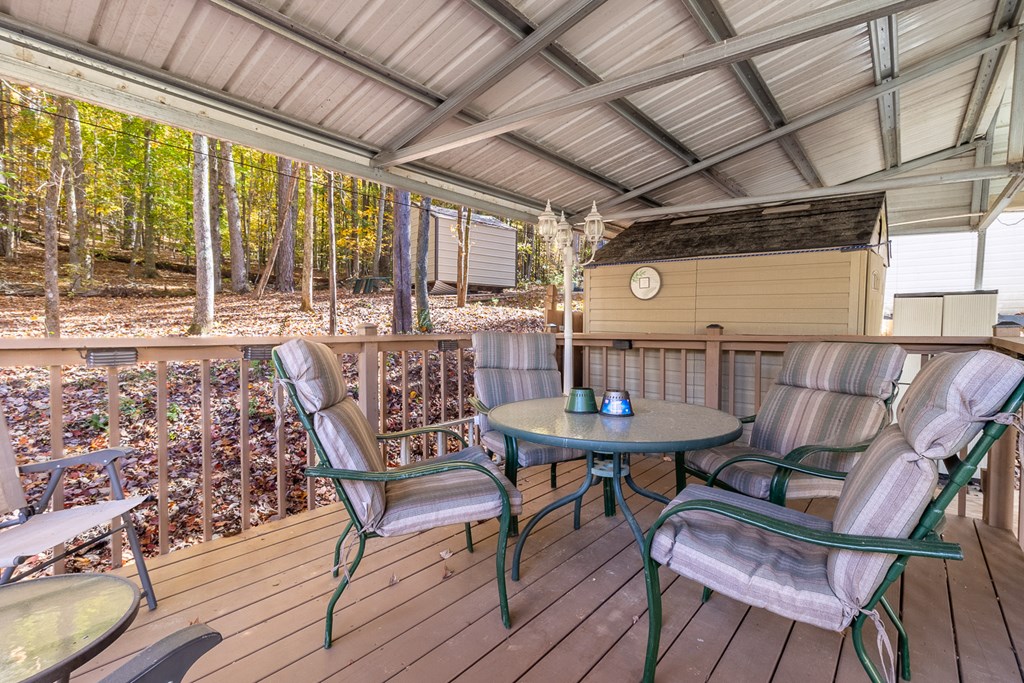 66-186 Peaceful Loop Chatsworth, GA 30705 - Photo 13 of 31 a view of a table and chairs in patio