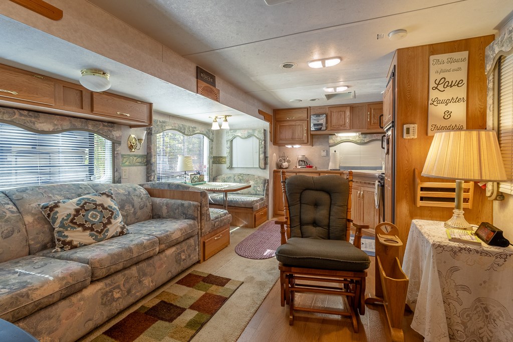 66-186 Peaceful Loop Chatsworth, GA 30705 - Photo 2 of 31 a living room with furniture and a fireplace