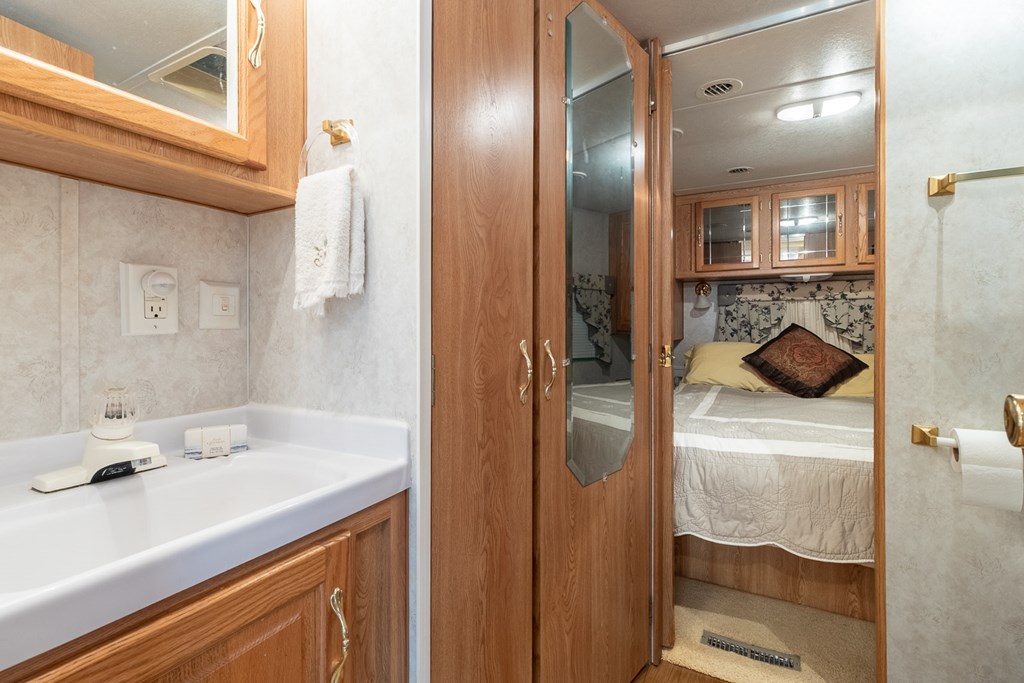 66-186 Peaceful Loop Chatsworth, GA 30705 - Photo 8 of 31 a en suite bathroom with a sink and mirror