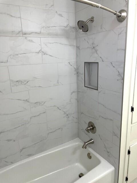 2409 Utica Avenue Lubbock, TX 79407 - Photo 11 of 22 a bathroom with a bathtub