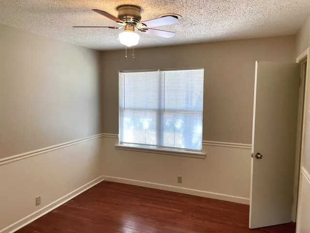 a view of a hallway with a chandelier