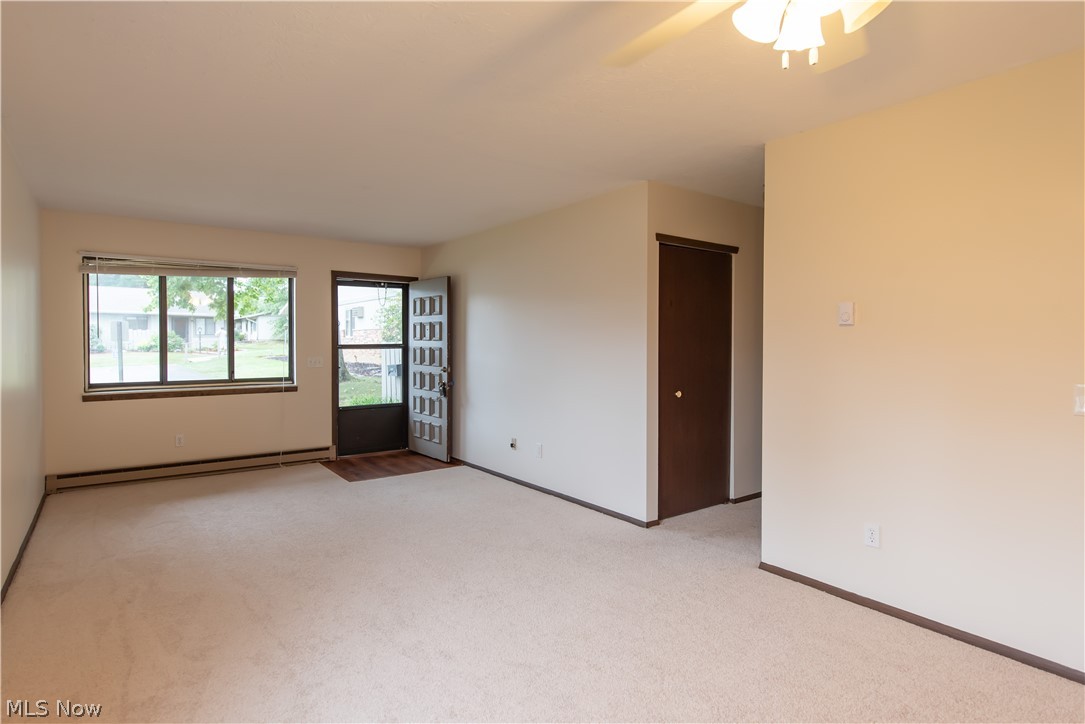 2749 Mull Avenue Akron, OH 44321 - Photo 6 of 14 The large, well-lit living room features new carpeting and fresh paint.
