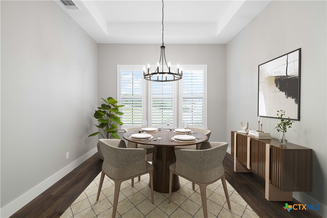 537 Compass Rose Spring Branch, TX 78070 - Photo 11 of 29 a dining room with furniture potted plants and wooden floor