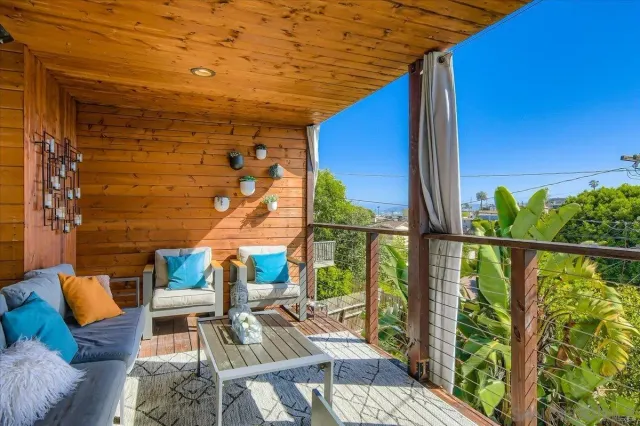a view of balcony with furniture