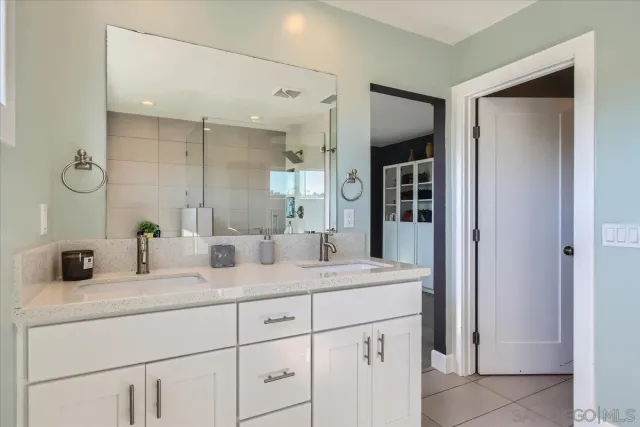 a view of walk in closet with clothes