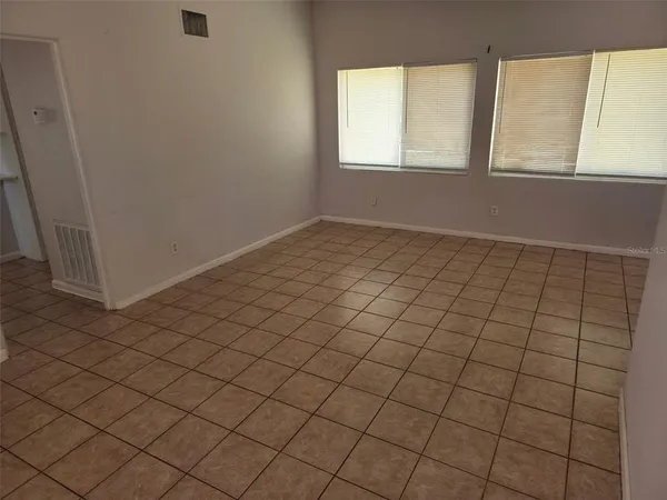 a kitchen with a stove top oven and cabinets