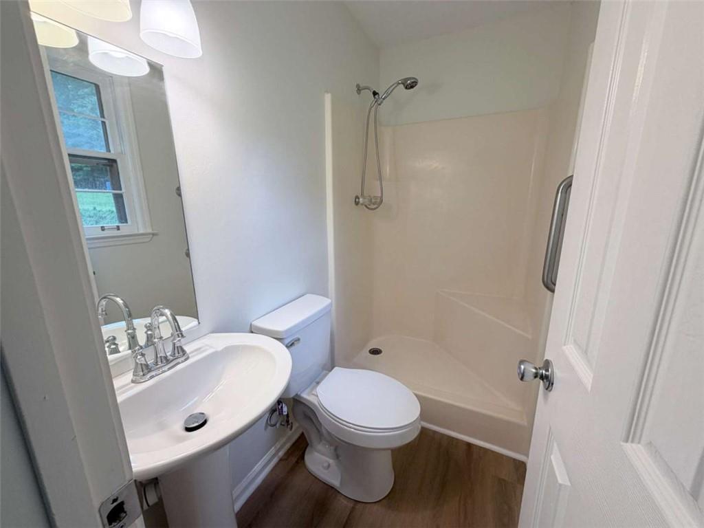 185 Roberts Road Covington, GA 30016 - Photo 20 of 25 a bathroom with a sink a toilet and shower