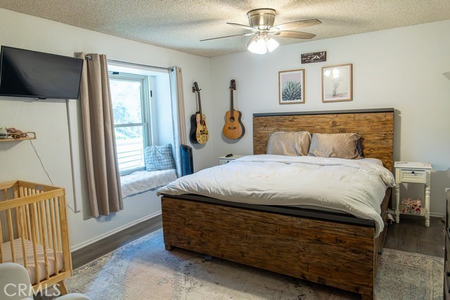 600 Central, Unit 374 Riverside, CA 92507 - Photo 12 of 23 a bed sitting in a bedroom next to a window