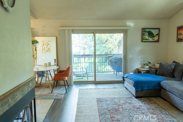 600 Central, Unit 374 Riverside, CA 92507 - Photo 3 of 23 a living room with furniture and a floor to ceiling window