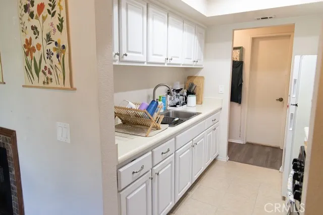 a kitchen with cabinets and a sink
