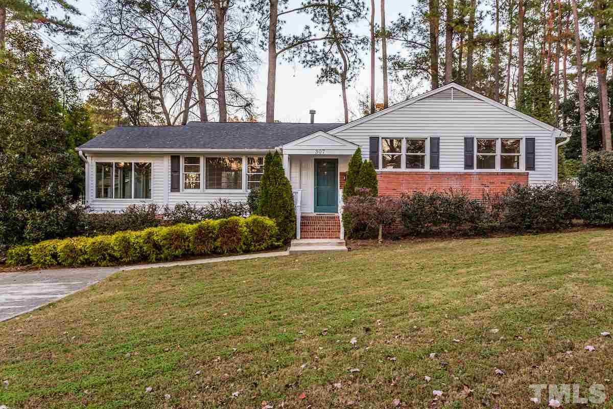 307 Acorn Street Raleigh, NC 27604 - Photo 1 of 24 a front view of a house with a garden