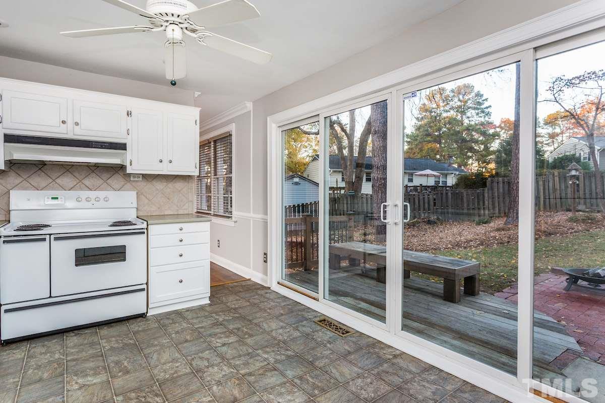 307 Acorn Street Raleigh, NC 27604 - Photo 12 of 24 a kitchen with stainless steel appliances a stove sink and cabinets