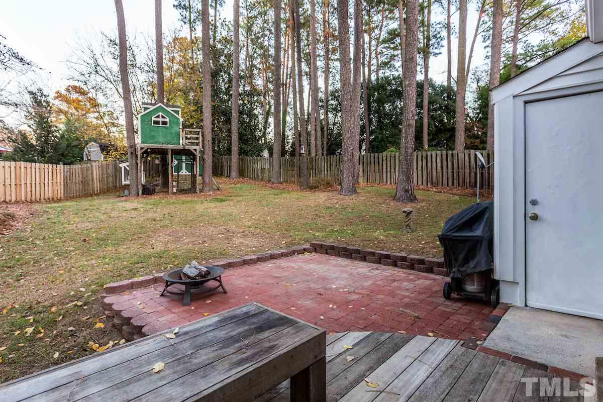 307 Acorn Street Raleigh, NC 27604 - Photo 21 of 24 a view of a backyard with sitting area
