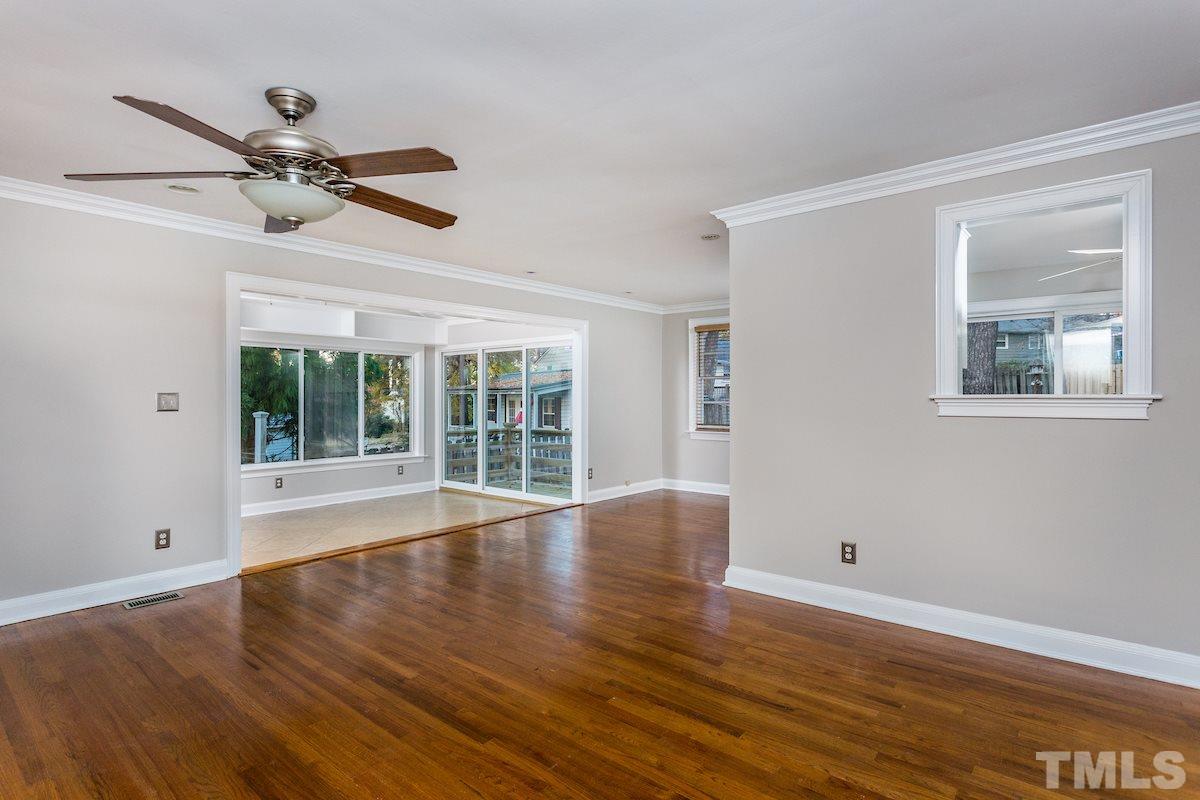 307 Acorn Street Raleigh, NC 27604 - Photo 5 of 24 a view of empty room with wooden floor and fan