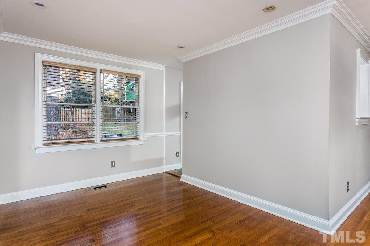 307 Acorn Street Raleigh, NC 27604 - Photo 6 of 24 a view of empty room with wooden floor and fan
