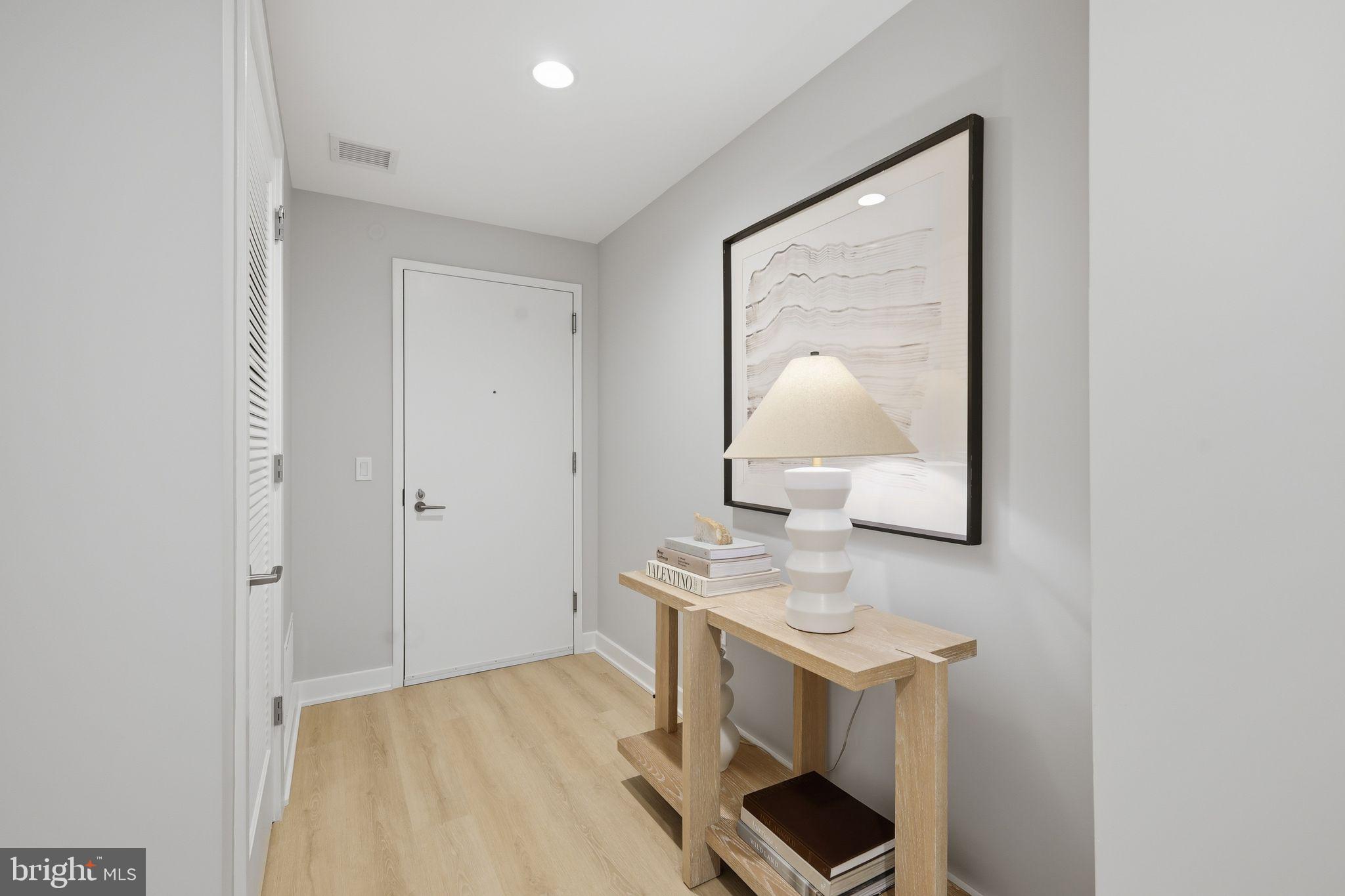950 3rd Street Northwest, Unit 1009 Washington, DC 20001 - Photo 27 of 32 a view of hallway with sink and mirror