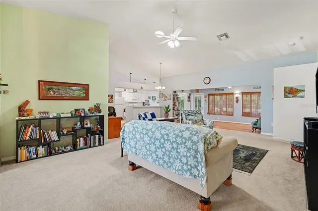 a bed room with furniture and a baby crib