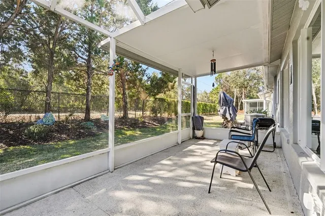 a view of a patio with a backyard table and chairs