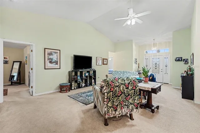 a view of a livingroom with workspace and a window