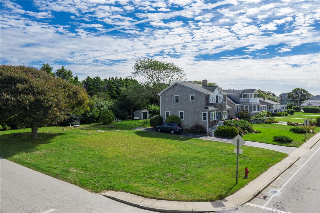 11 Weekapaug Road is a flat, grass covered corner lot with a lovely large tree. The structure seen in previous listings was removed by this owner in Summer 2018.