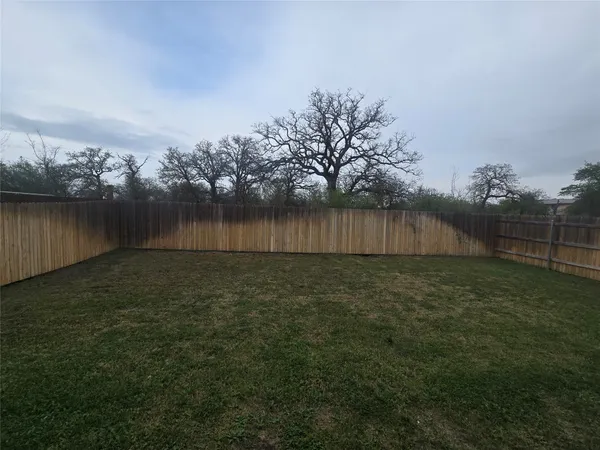 a view of a backyard with green space