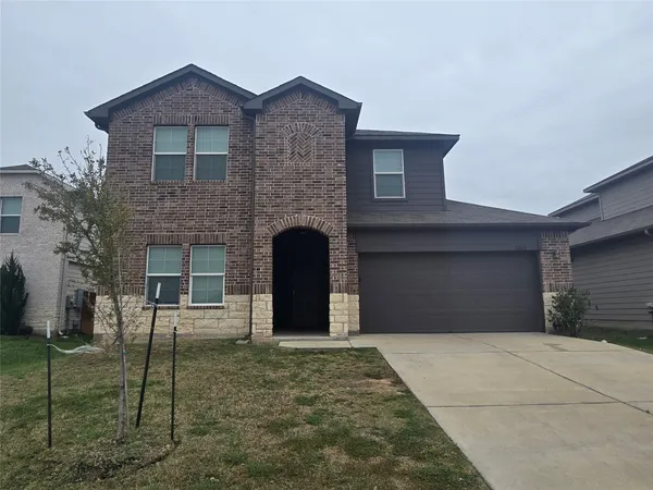 a front view of a house with a garage