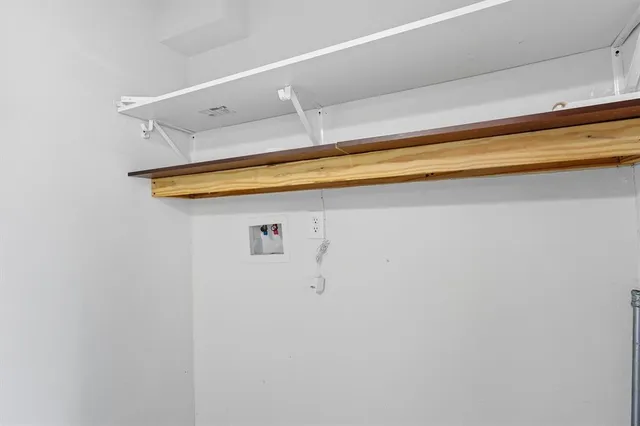 a room view with wooden floor and closet