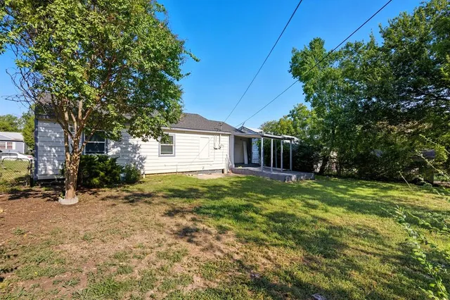 a view of a room that has a sink and a bench in it