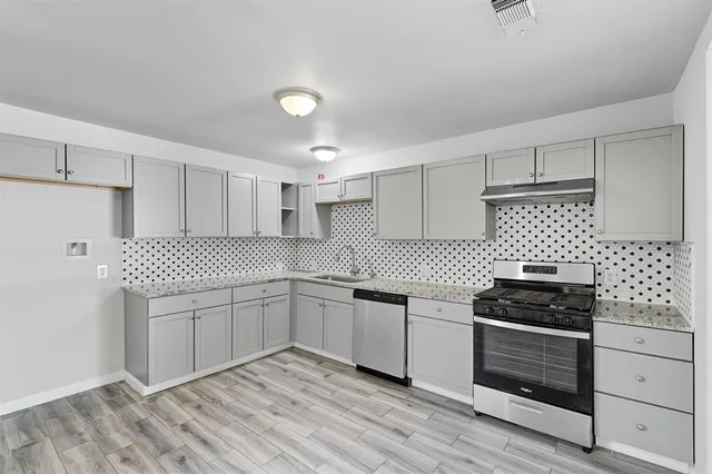 a view of kitchen with wooden floor