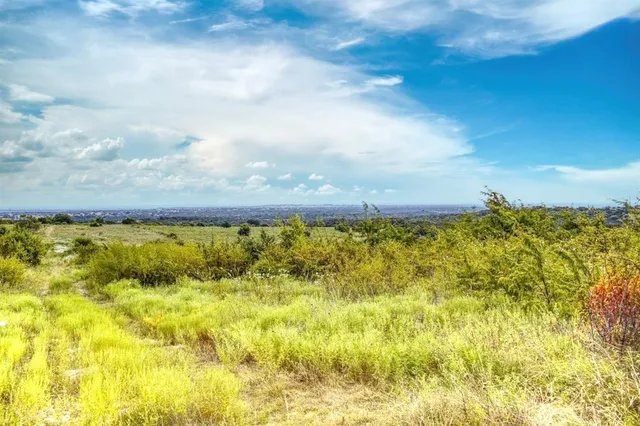 a view of a lake with a big yard