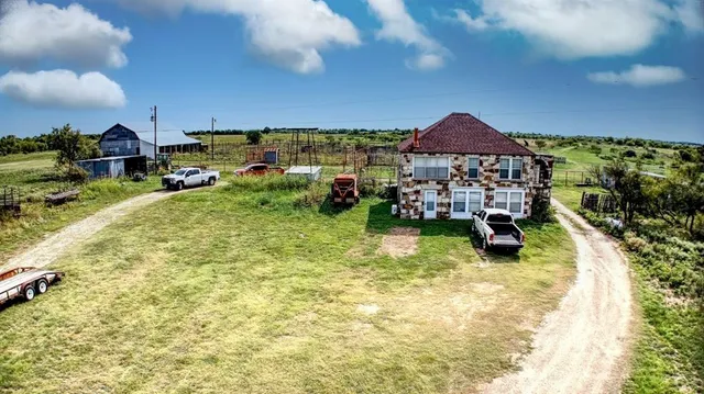 a view of a big yard with lots of green space