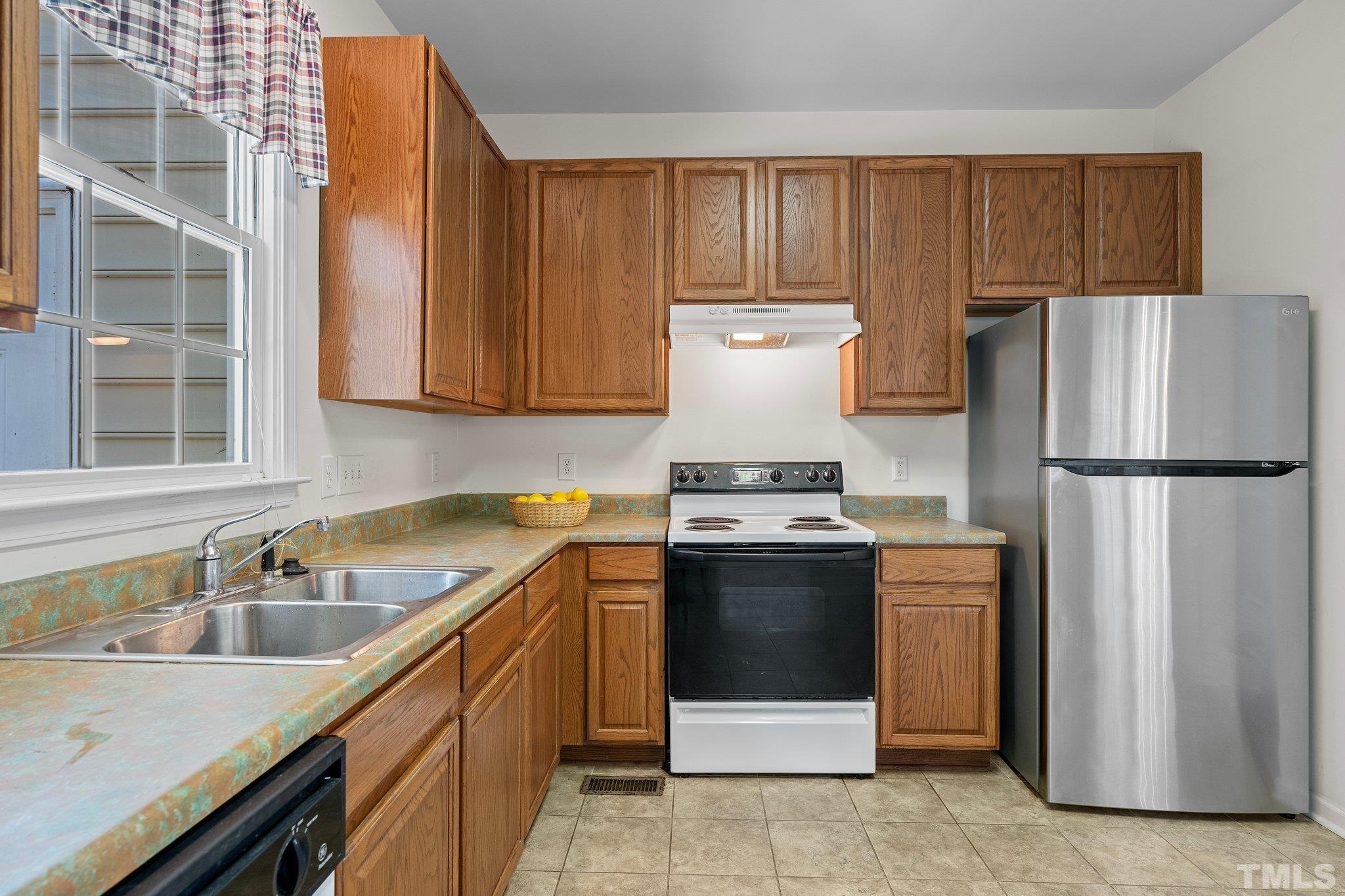 37 Lure Court Durham, NC 27713 - Photo 13 of 35 a kitchen with stainless steel appliances granite countertop a refrigerator stove and sink