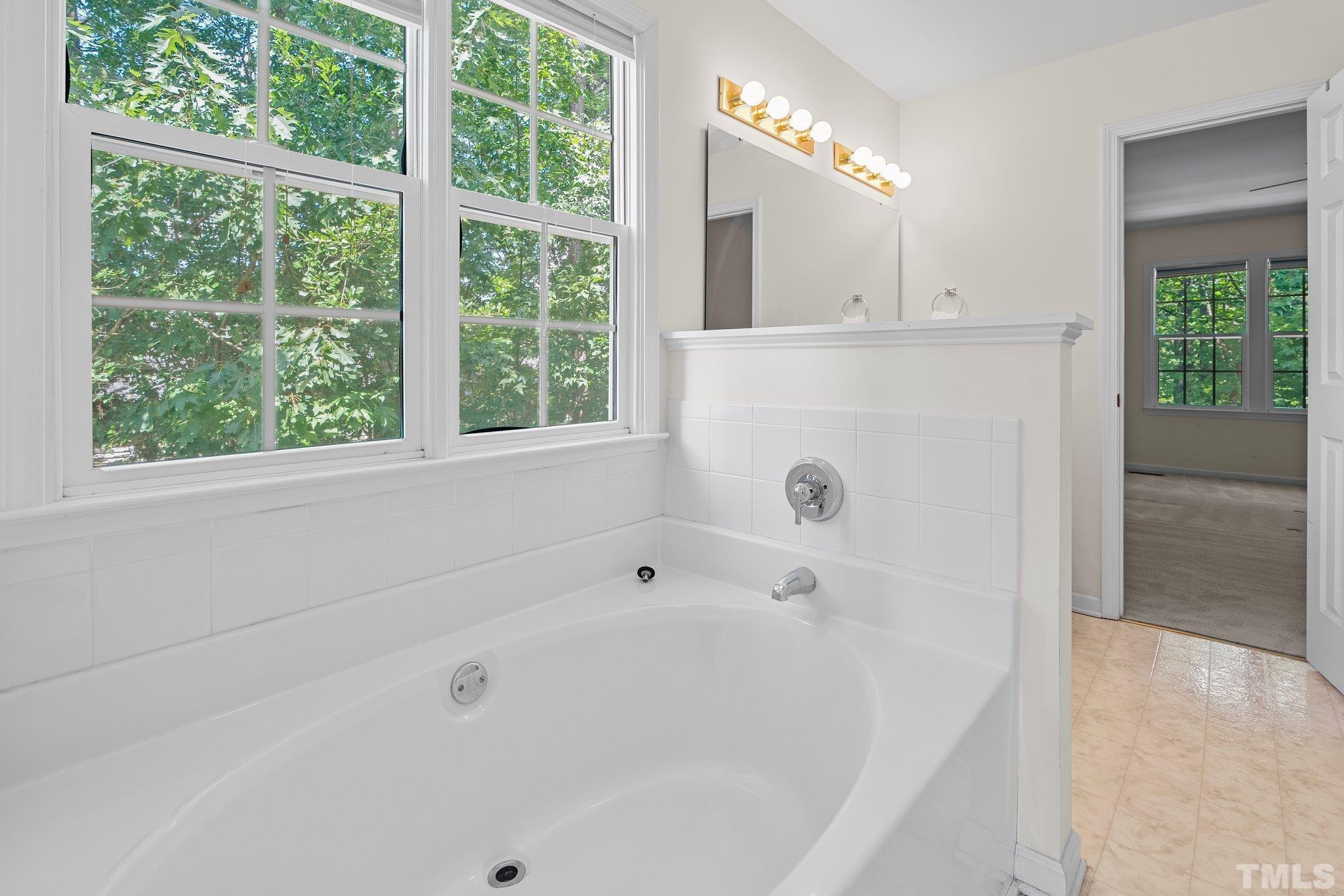 37 Lure Court Durham, NC 27713 - Photo 23 of 35 a bathroom with a bathtub and shower