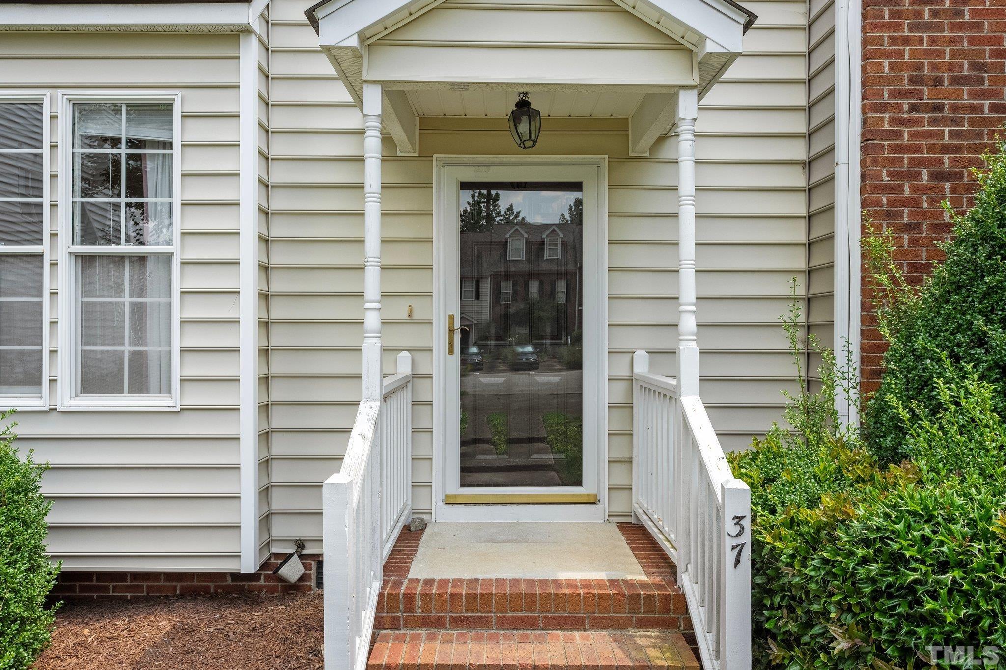 37 Lure Court Durham, NC 27713 - Photo 5 of 35 a view of house with entryway and windows