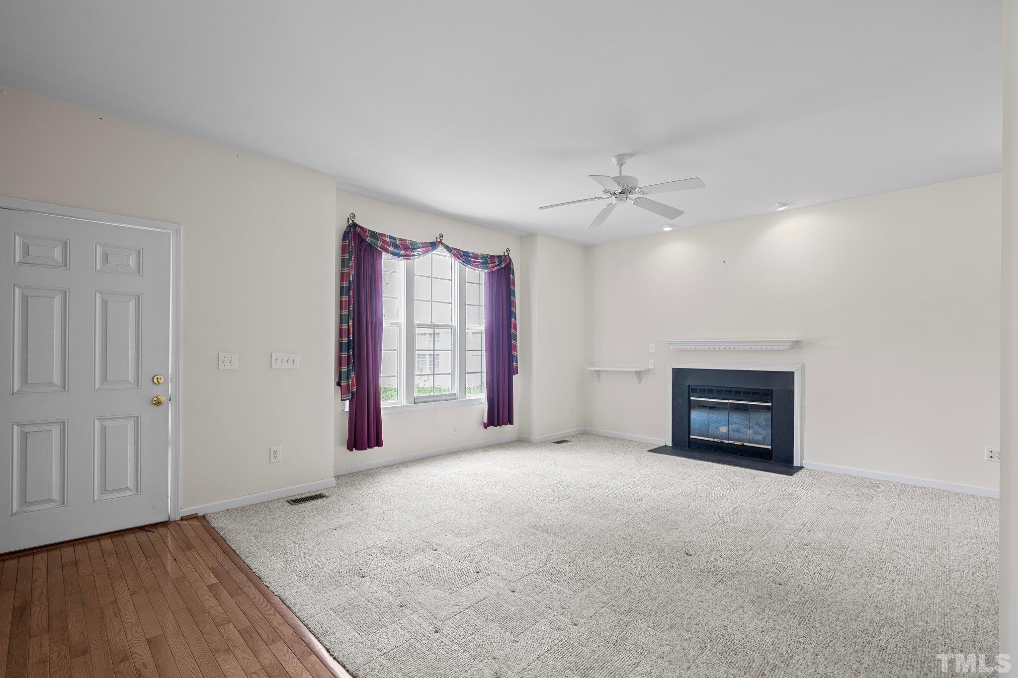 37 Lure Court Durham, NC 27713 - Photo 6 of 35 an empty room with windows fireplace and a sink