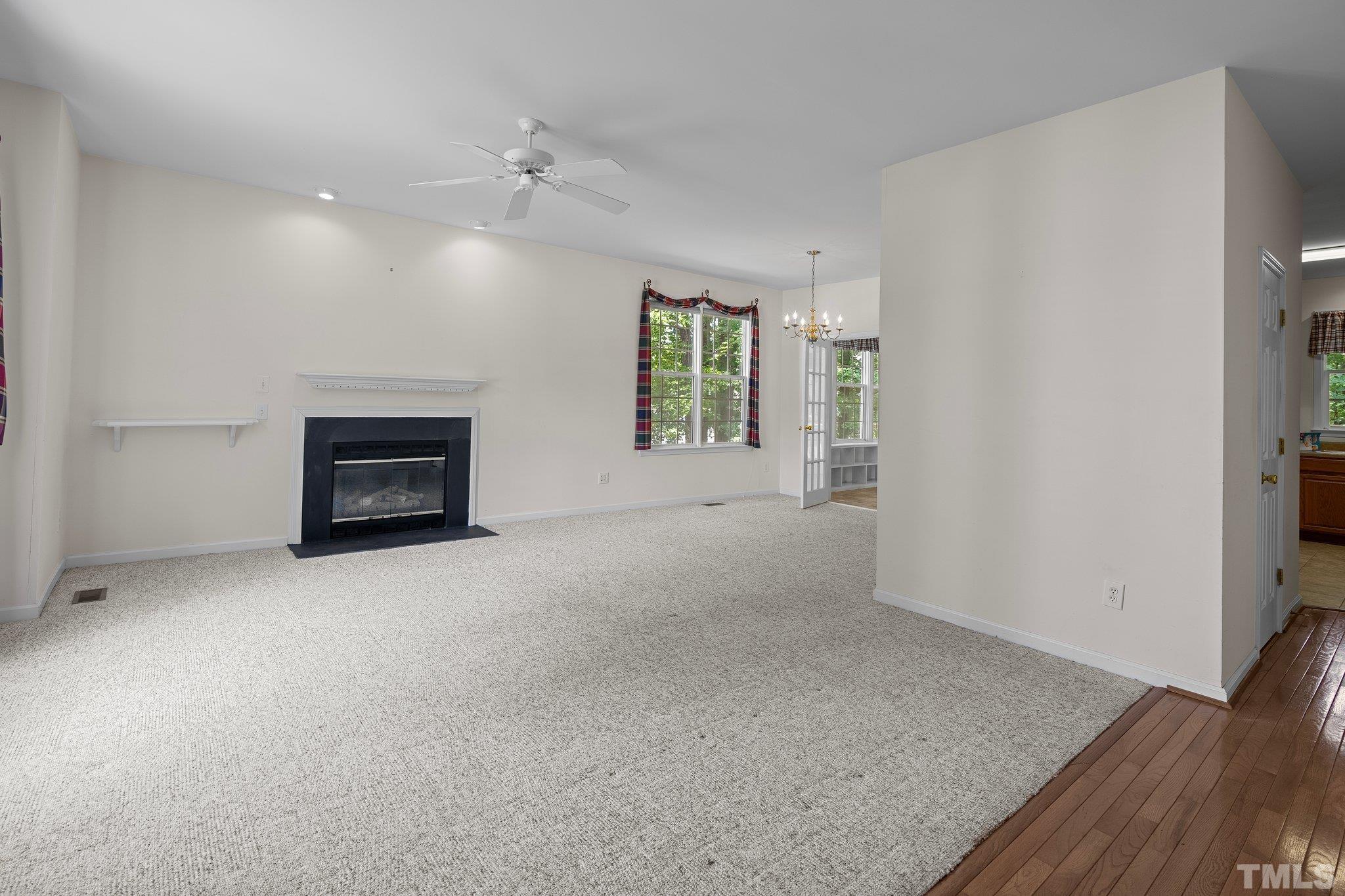 37 Lure Court Durham, NC 27713 - Photo 7 of 35 an empty room with windows and fireplace